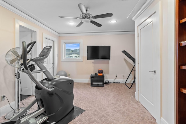 workout room featuring crown molding, light carpet, and ceiling fan