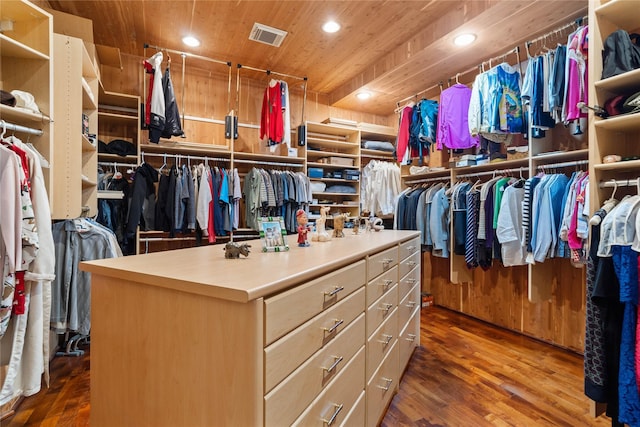 spacious closet featuring dark hardwood / wood-style flooring