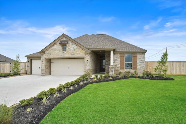 view of front facade with a garage and a front yard