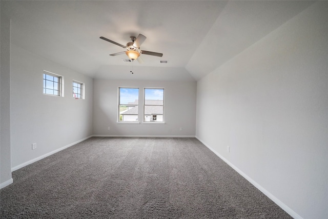 carpeted spare room featuring lofted ceiling and ceiling fan