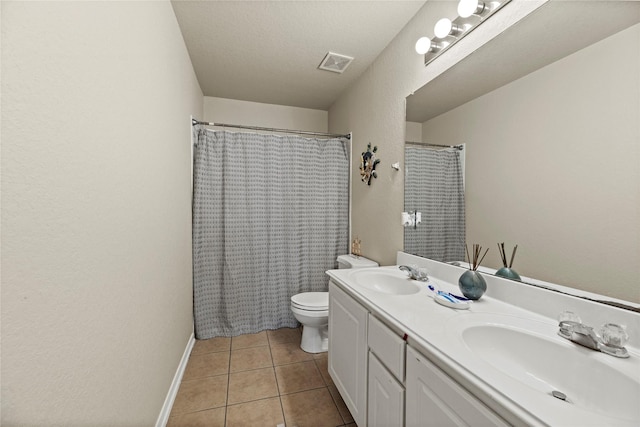 bathroom with vanity, tile patterned floors, toilet, and a shower with shower curtain