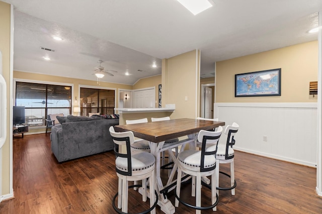 dining space with lofted ceiling, dark hardwood / wood-style floors, and ceiling fan