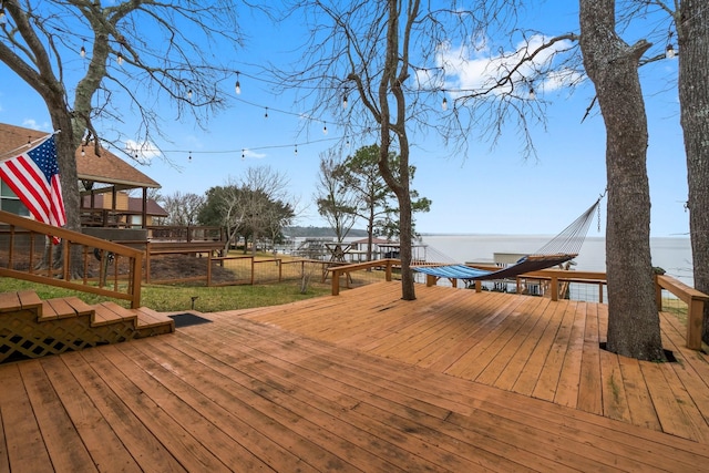 wooden terrace with a water view