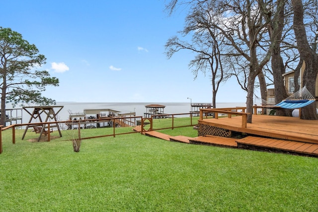 view of yard featuring a deck with water view