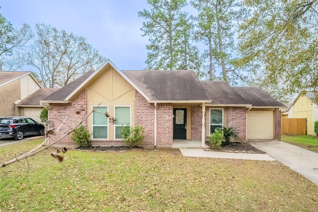 view of front of property featuring a garage and a front lawn