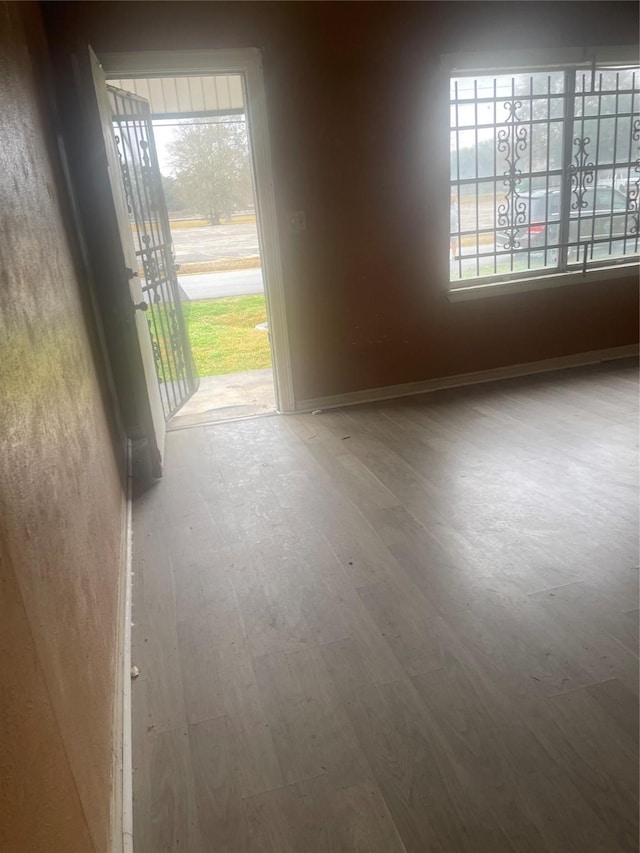 spare room featuring hardwood / wood-style floors