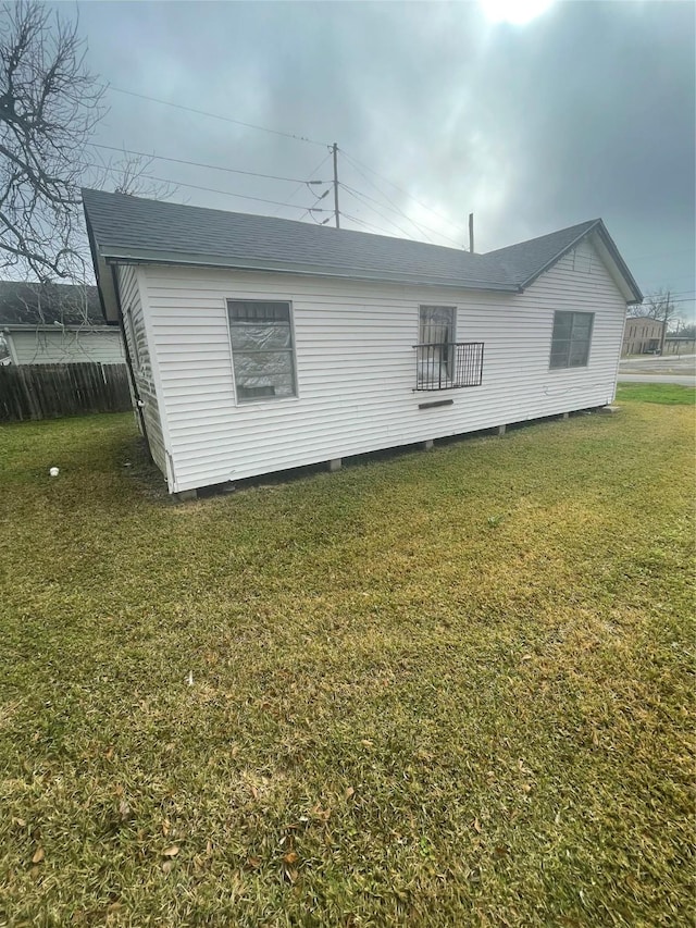 view of home's exterior with a yard