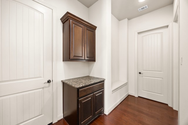 hallway featuring dark wood-type flooring