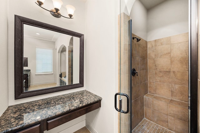 bathroom with a shower with shower door