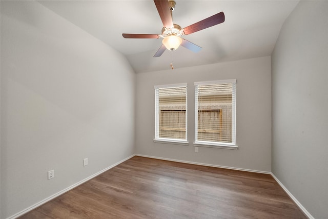 spare room with lofted ceiling, hardwood / wood-style floors, and ceiling fan