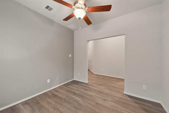 unfurnished room with ceiling fan and light hardwood / wood-style flooring