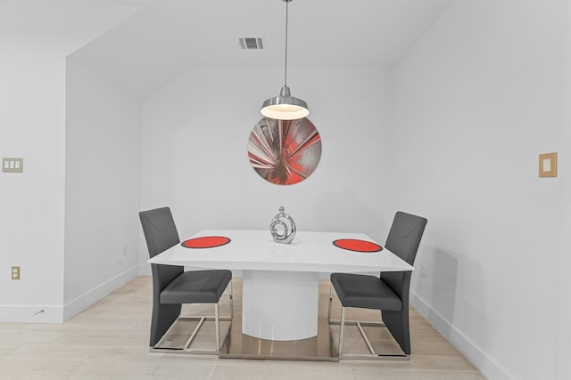 dining area featuring light wood-type flooring