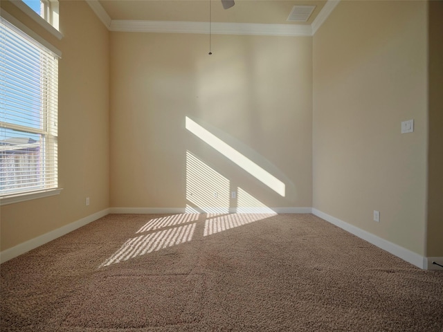 unfurnished room featuring ornamental molding and carpet flooring