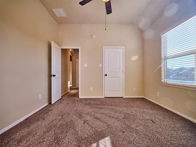 unfurnished bedroom with ceiling fan and carpet