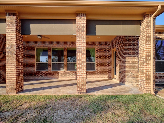 property entrance with ceiling fan and a patio