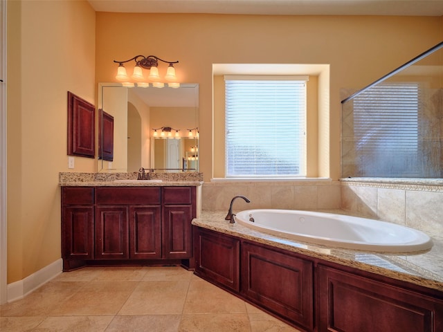 bathroom with vanity, a tub to relax in, and tile patterned floors