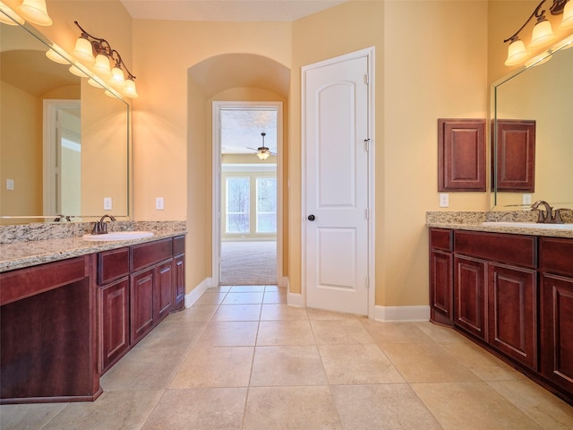 bathroom featuring tile patterned flooring and vanity