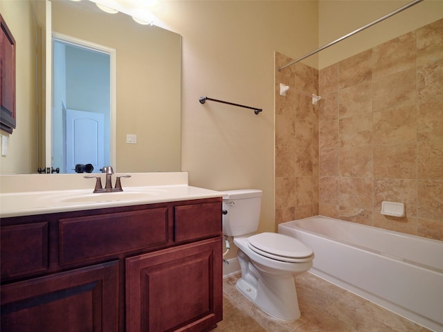 full bathroom with tile patterned flooring, vanity, toilet, and tiled shower / bath