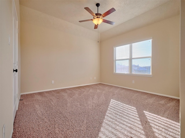 carpeted empty room featuring a textured ceiling and ceiling fan