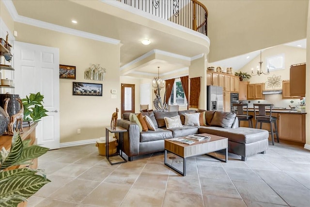 tiled living room with crown molding, a high ceiling, and a notable chandelier