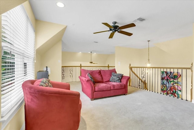 living room with ceiling fan and light carpet