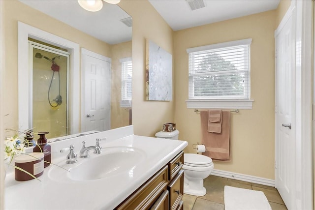 bathroom featuring a shower, toilet, tile patterned floors, and vanity