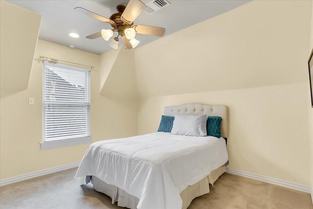 bedroom featuring light colored carpet and ceiling fan