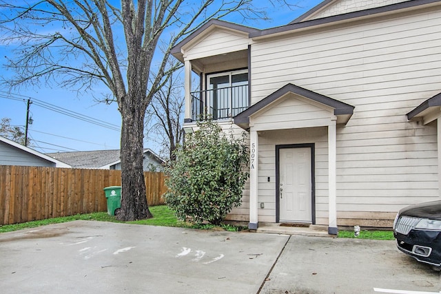 doorway to property with a balcony and a patio area