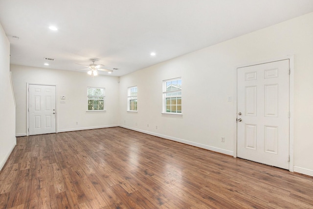 empty room featuring wood-type flooring and ceiling fan