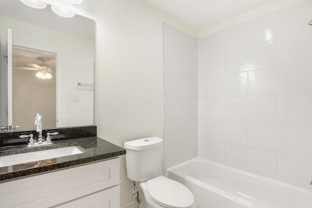 full bathroom featuring vanity, tiled shower / bath, ceiling fan, and toilet