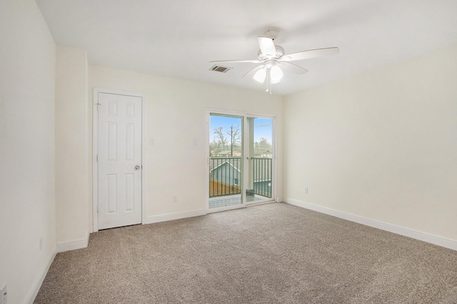 carpeted empty room featuring ceiling fan