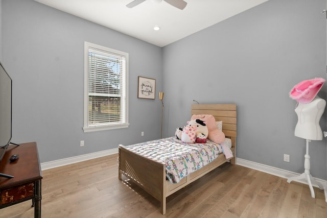 bedroom featuring ceiling fan and light hardwood / wood-style floors