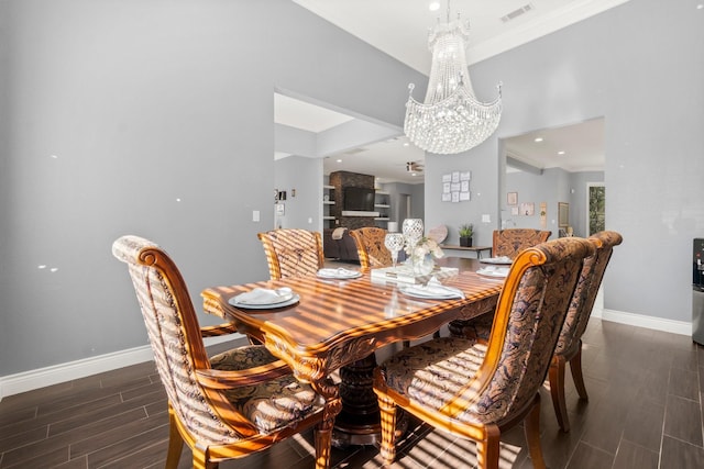 dining space featuring an inviting chandelier and crown molding