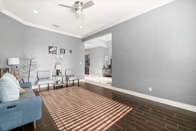 living room featuring ornamental molding and ceiling fan