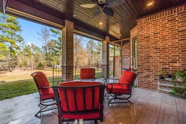 view of patio featuring ceiling fan