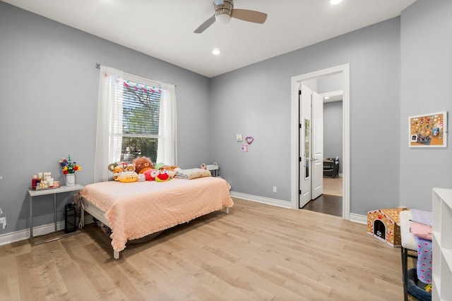 bedroom with hardwood / wood-style flooring and ceiling fan