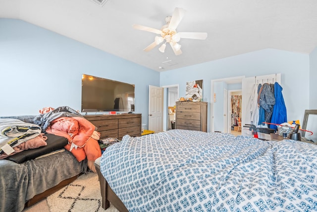 bedroom with ceiling fan and lofted ceiling