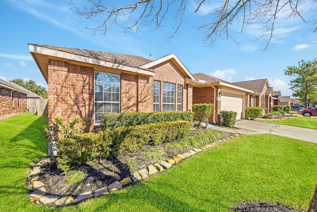 single story home featuring a garage and a front yard