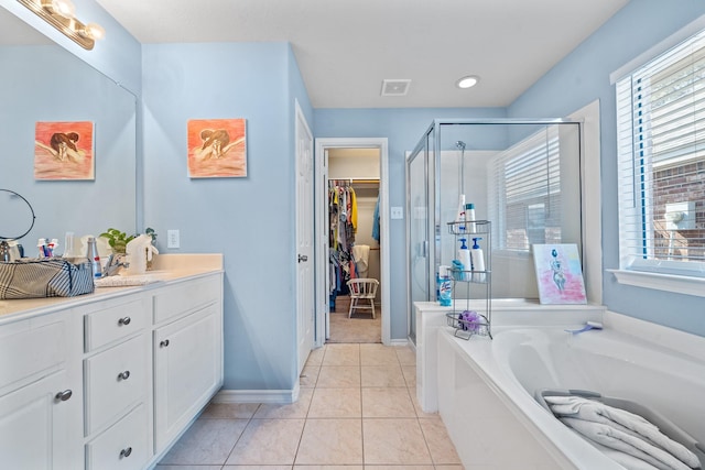 bathroom with vanity, tile patterned floors, and independent shower and bath