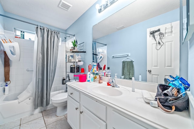 full bathroom with vanity, toilet, tile patterned flooring, and shower / tub combo