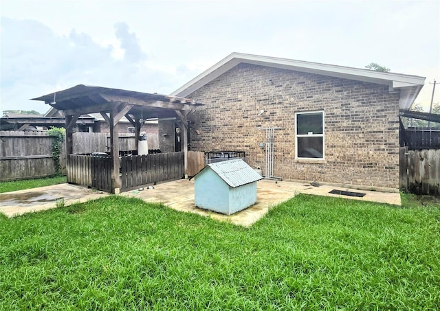 rear view of house featuring a lawn