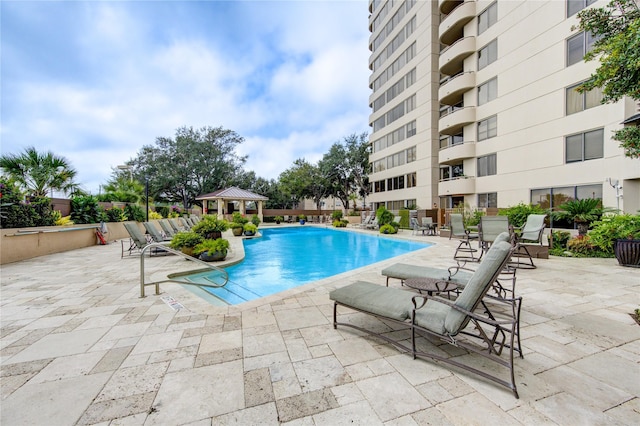 view of pool with a gazebo and a patio area