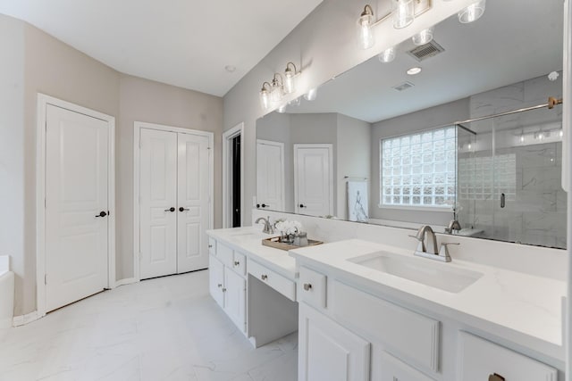 bathroom with walk in shower and vanity