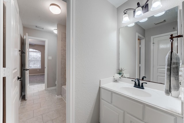 bathroom with tile patterned flooring, vanity, and washtub / shower combination