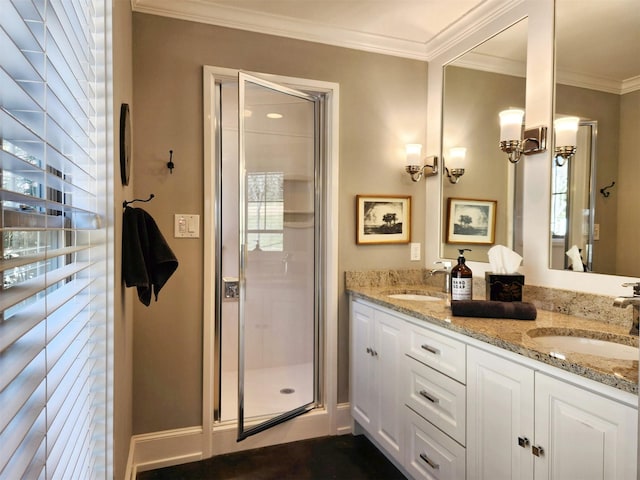 bathroom featuring crown molding, vanity, and a shower with shower door