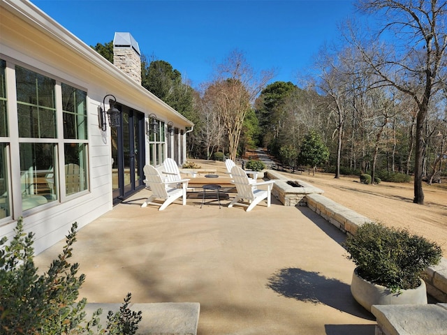 view of patio with an outdoor fire pit