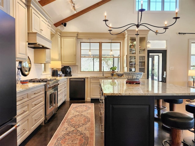 kitchen with light stone countertops, stainless steel appliances, a breakfast bar, and premium range hood