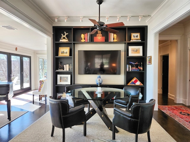 interior space featuring ornamental molding, built in features, french doors, and ceiling fan