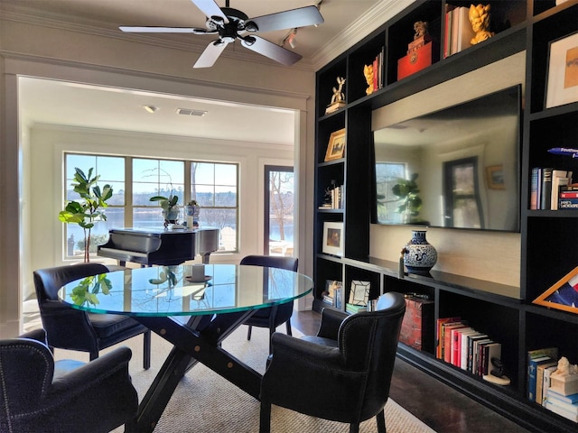 office area featuring ornamental molding, ceiling fan, and built in shelves