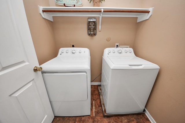 laundry room with washing machine and clothes dryer